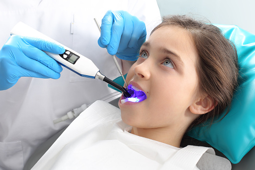 Girl getting dental sealants