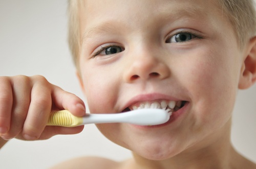 Little boy brushing his teeth